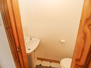 A small bathroom with a sink and toilet at Knockbrack in Lonart near Killorglin County Kerry