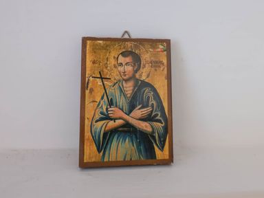 A religious icon painting of a saint holding a cross on a wall at Flat 1 in Scarborough