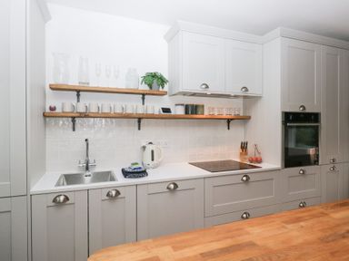 A kitchen with cabinetry and appliances at The Wonky Nest Bowness-On-Windermere