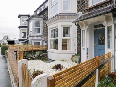 A front yard with a fence and a door at The Wonky Nest in Bowness-On-Windermere