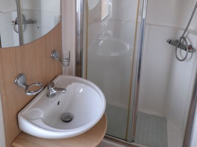 A bathroom with a sink and shower at Oak in Denny