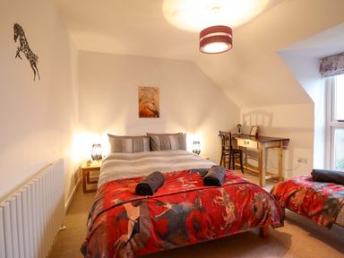 A bedroom with a bed and desk at Bryn Y Garreg - The Wireless Free Farm (No Tech!) Y Trallwng