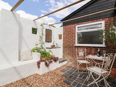 An outdoor area with a table and chairs at The Corner House Ufford near Woodbridge