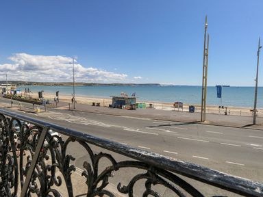 A beach view from a balcony at Apartment 1 in Weymouth