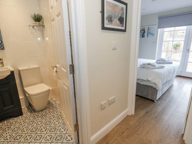 A bathroom with a toilet and washbasin at Vista Mare 1 in Weymouth