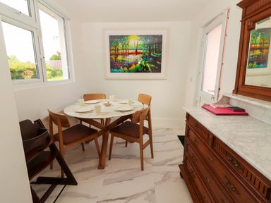 A dining room with a table and chairs at Rosemont in Adare