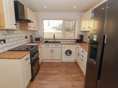 A kitchen with modern appliances at 41 St. James Street Narberth