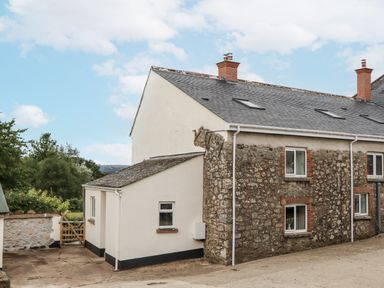 A house with windows and a gate at Aunty Junes Cottage Okehampton