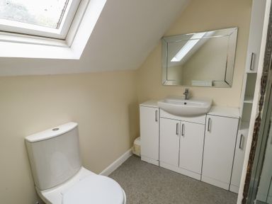 A bathroom with a sink and toilet at 9 Beckett Close in Colwyn Bay