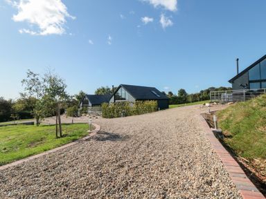 A gravel driveway leading to houses at Hare's Hill in Thornton-Le-Dale