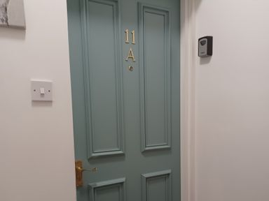 A door with number 11A and a keypad at 11A High Street in Jedburgh