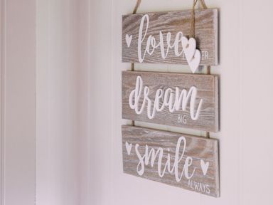 Decorative wooden signs with text at Bonnie's Shepherds Hut at Shepherds Lodge Retreat and Wellness Bottesford near Redmile and Vale of Belvoir