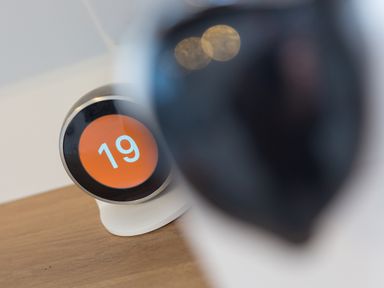 A smart thermostat displaying the number 19 on a wooden surface at Captain's Walk in Newquay