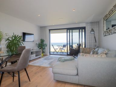 A living room with a sofa and a tv at Apartment 8 in 