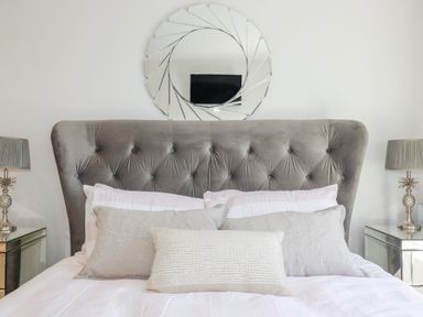 A bedroom with a bed and decorative pillows at Apartment 8
