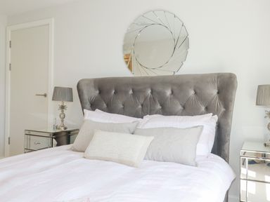 A bedroom with a bed and bedside tables at Apartment 8 in 