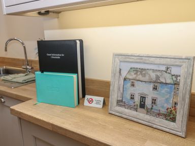 A kitchen countertop with a sink and various items at 1 Brookside in Warcop