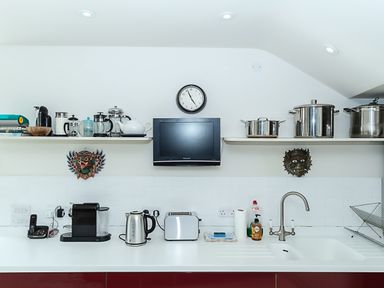 A kitchen with appliances on the counter including a kettle toaster and coffee machine at Curlew House in Cosheston