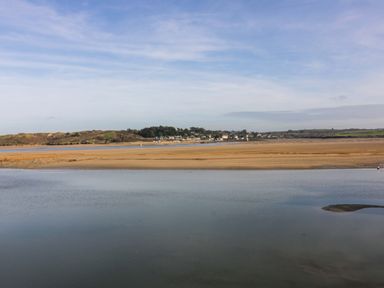 A view of water and sandy landscape at H2 Atlantic Bay Holiday Park Padstow