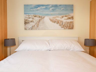 A bedroom with bed and lamps at 161 Atlantic Bay Holiday Park, Padstow