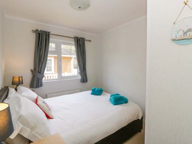 A bedroom with a double bed and towels at Erisa in Stepaside