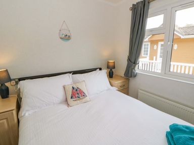 A bedroom with a bed and side tables at Erisa in Stepaside