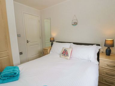 A bedroom with a bed and bedside tables at Erisa in Stepaside