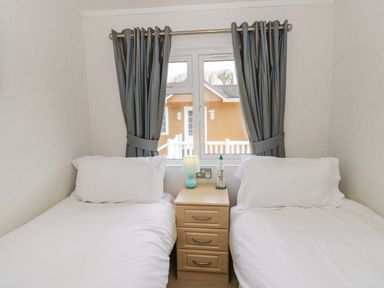 A bedroom with two beds and a window at Erisa in Stepaside