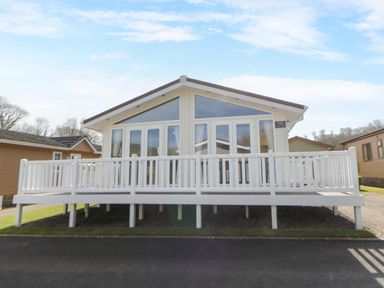 A house with a veranda and large windows at Erisa in Stepaside
