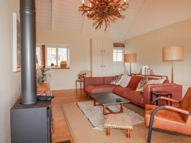 A living room with a sofa and coffee table at Roughtor Barn Poldue near Camelford