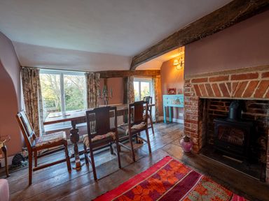 A dining room with a table and chairs at 5 St. Michaels Close in Framlingham
