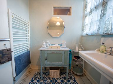 A bathroom with a sink and mirror at 5 St. Michaels Close Framlingham