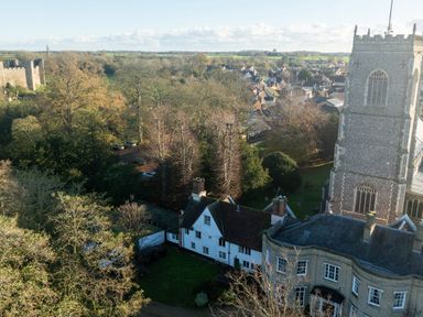 An aerial view of buildings and trees at 5 St. Michaels Close Framlingham