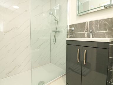 A bathroom with a walk in shower and a sink cabinet at Garden View in Hillhead near Brixham