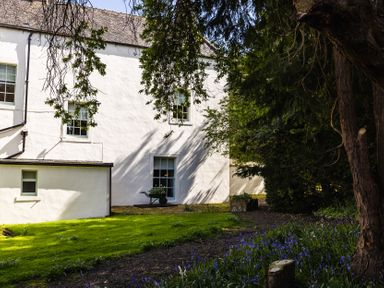 A house with a garden and trees at Primula Patch in Akeld near Wooler