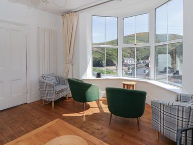 A living room with a view and seating at Brynmorfa in Llandysul