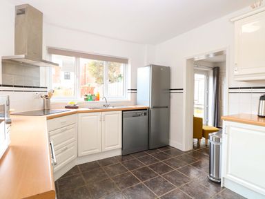 A kitchen with appliances and a countertop at Highland House in Sheringham