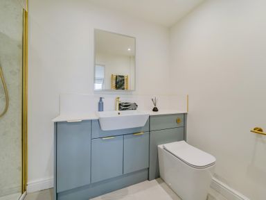 A bathroom with a sink and toilet at Seaddler in Trearddur Bay