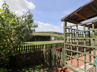 An outdoor area with a view of hills at Fir Tree Cottage in Cottonshopeburnfoot near Otterburn