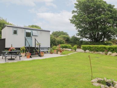 An outdoor area with a house-shaped structure and garden at Teg in Prospidnick near Porthleven