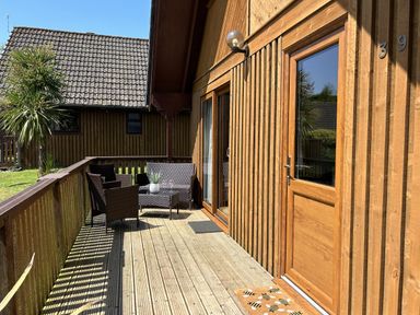 An outdoor area with seating and potted plant at Number 39 in Bodmin