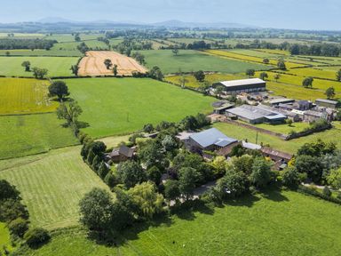 An aerial view of farmland and buildings at Larch Lodge in Skelton near Penrith
