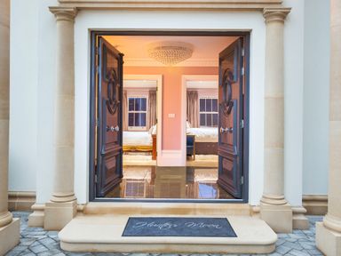 An entrance with open double doors revealing two bedrooms inside at Hunters Moon Charlestown
