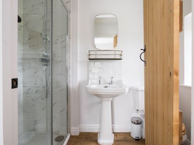 A bathroom with shower, sink, and toilet at Henhouse Farm in Bodenham