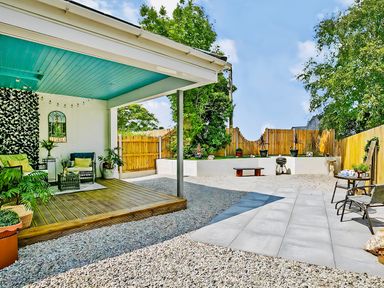 An outdoor patio area with seating and plants at The Studio in Crackington Haven