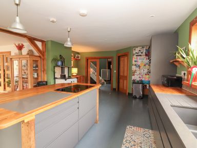 A kitchen with an island and appliances at Shanti Gher in Bantry