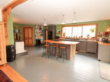 A kitchen with a sink and island at Shanti Gher in Bantry