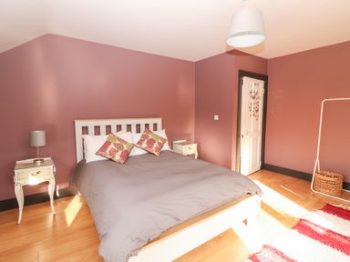 A bedroom with a bed and bedside table at Shanti Gher in Bantry