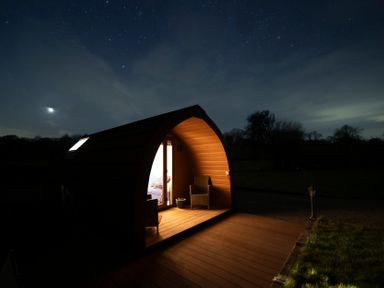 A hut with lighting at night with a view of the stars at Ty Twt Teifi Tregaron