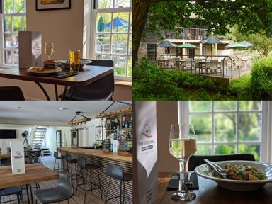 A dining area with tables and chairs at The Old Mill near Lanreath